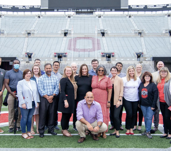 Alumni on field