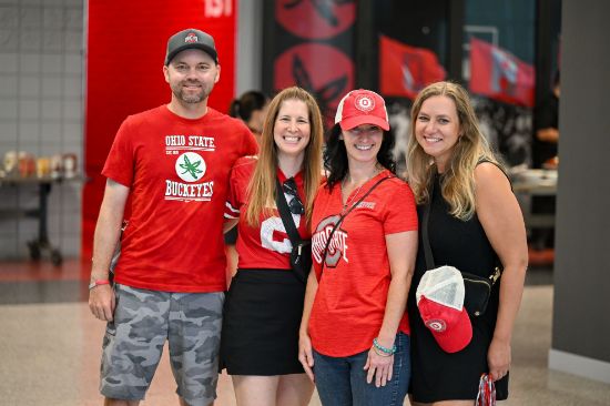 Four alumni standing together